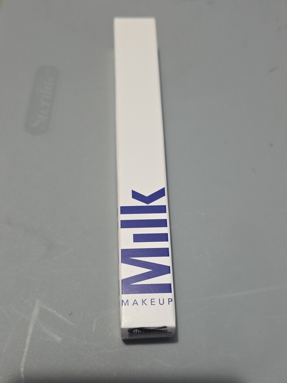 Milk Makeup Blue Eyeliner Pencil in Violet-Blue Packaging